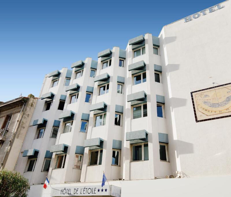 A bright, welcoming façade in the heart of Antibes, Hotel de l’Etoile stands just steps from the town’s lively streets. Its clean, modern exterior and prominent signage make it easy to spot, offering guests a comfortable base for exploring the Côte d’Azur.